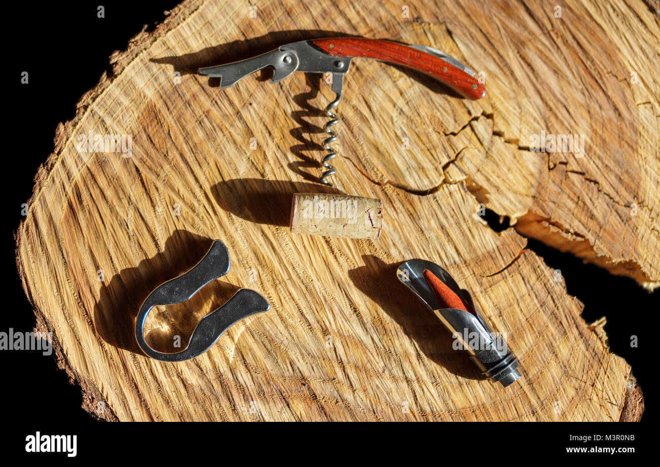 Natural cork with corkscrew on wooden table Stock Photo