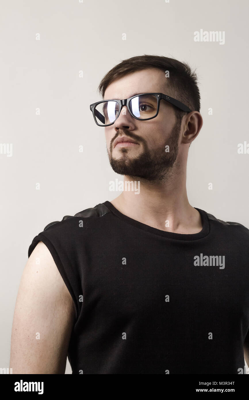 closeup. confident modern man looking over his glasses Stock Photo