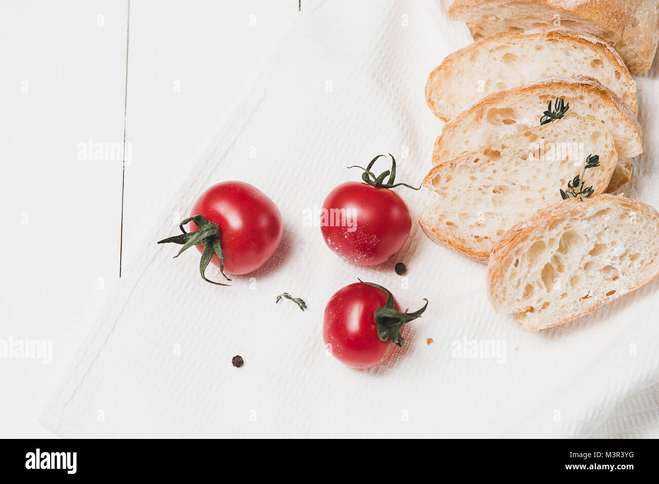 The fresh bread on a white table background Stock Photo - Alamy