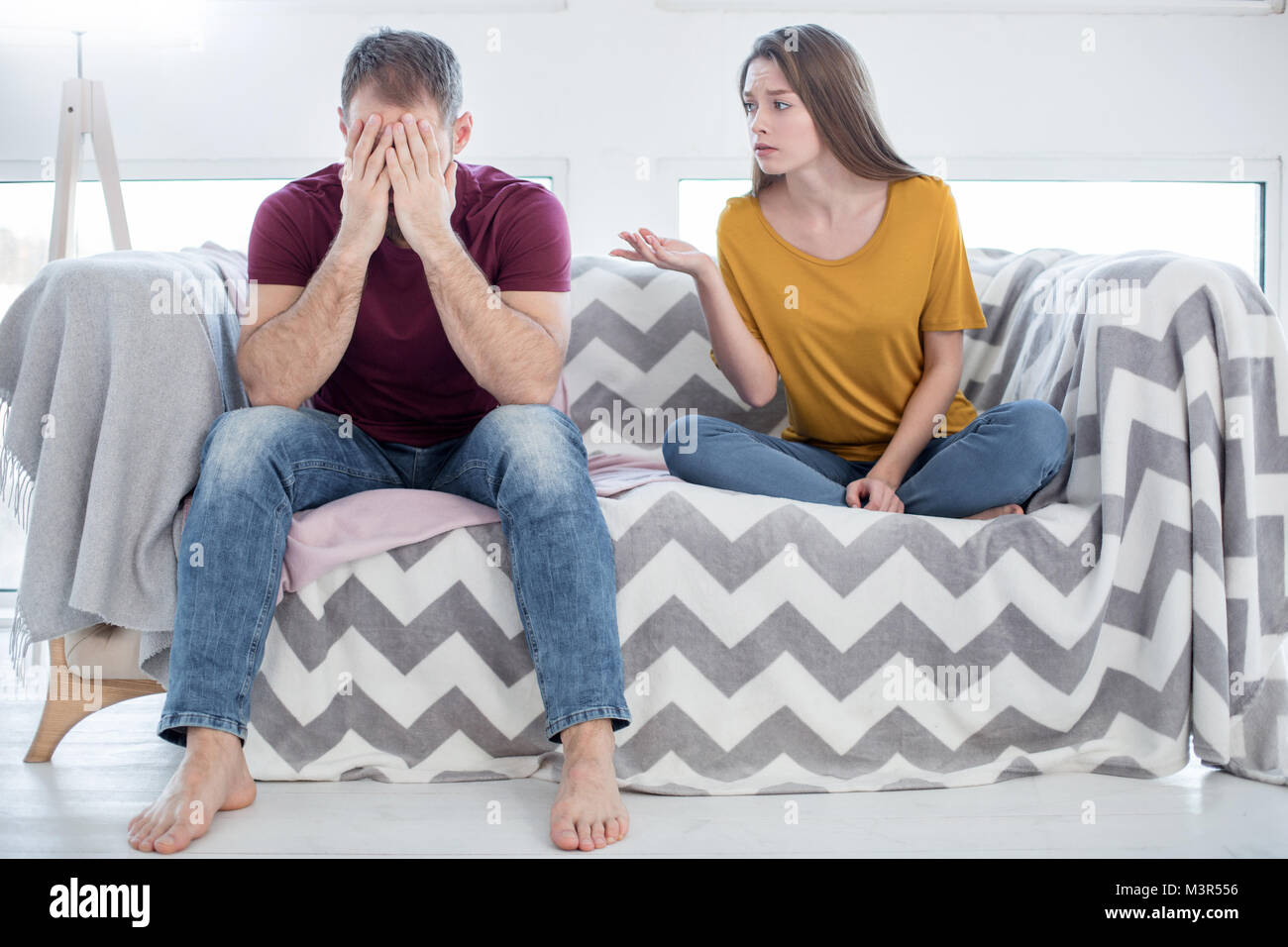 Unhappy woman talking to her man about his unfaithfulness Stock Photo ...