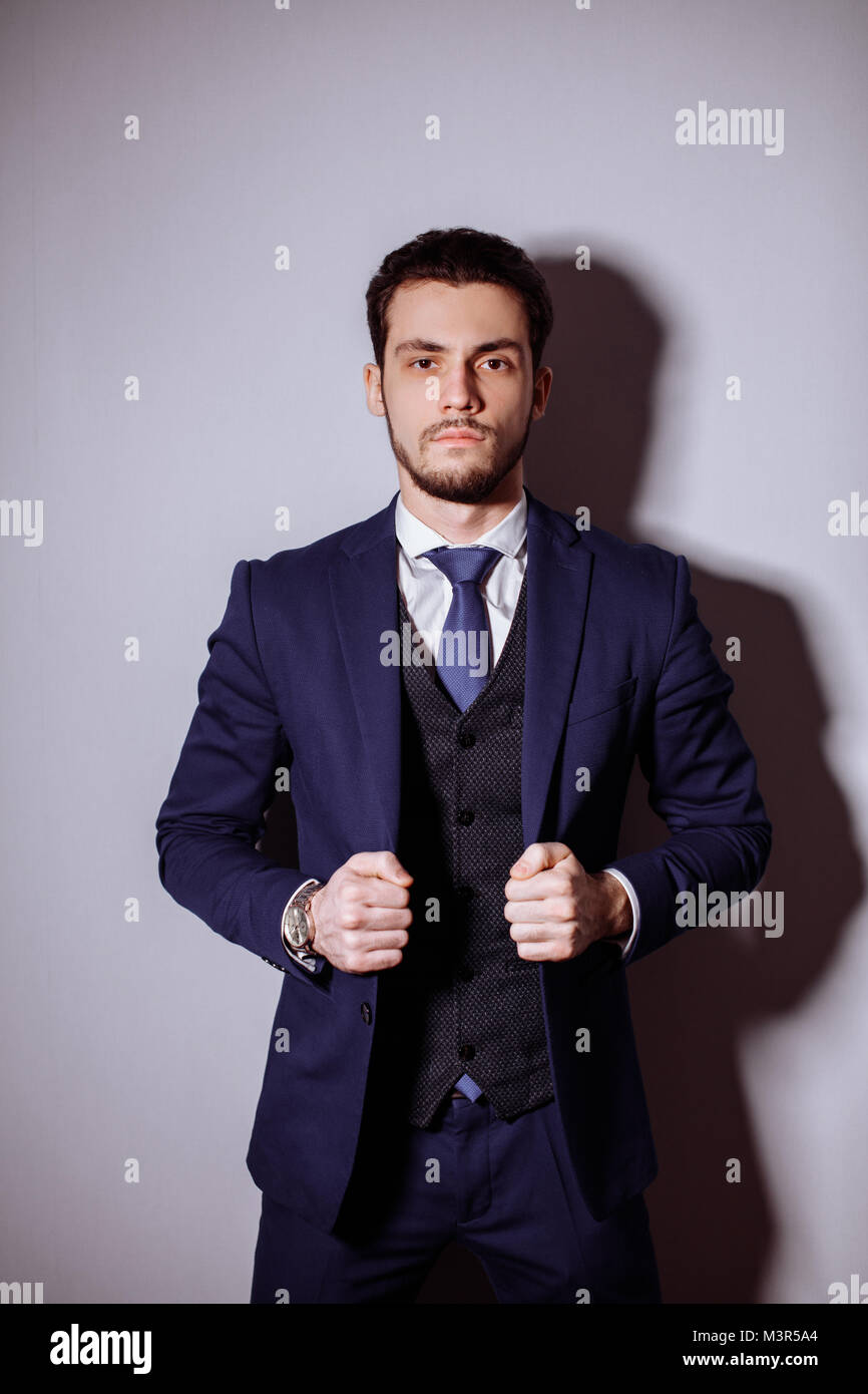happy businessman with arms crossed standing in office Stock Photo - Alamy
