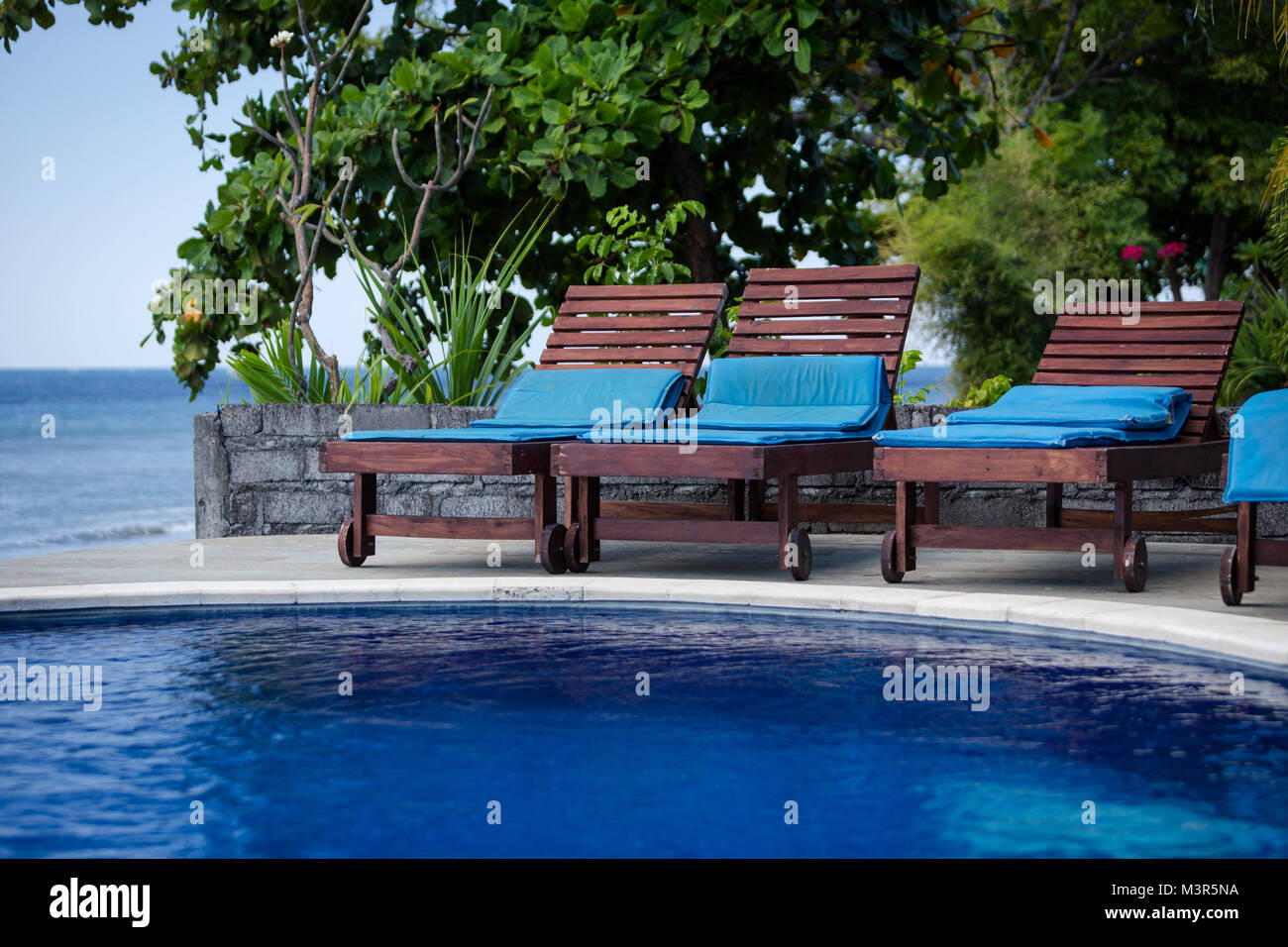 A sunbathing chair by the pool Stock Photo Alamy
