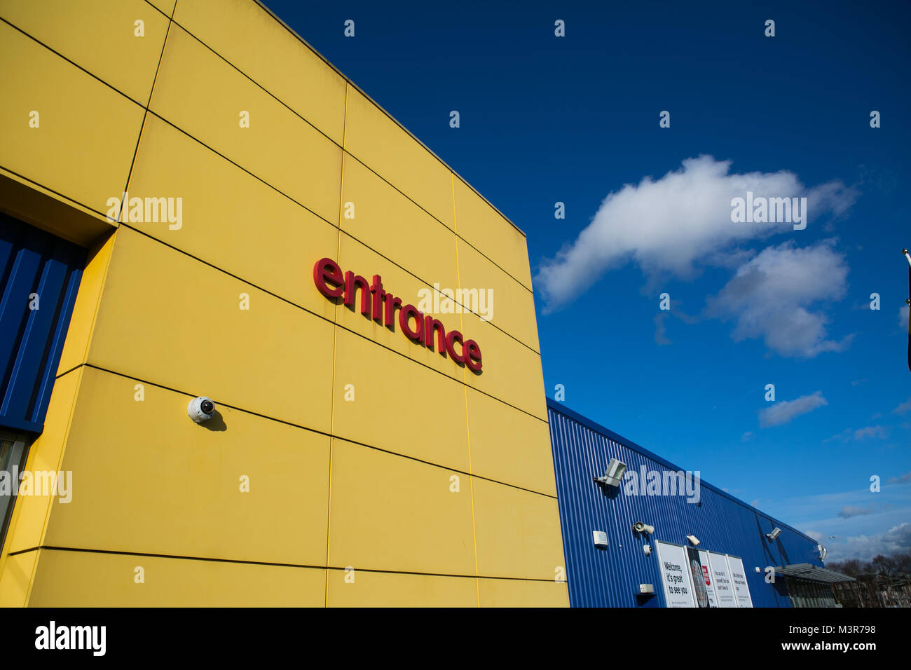 IKEA entrance sign on yellow wall outside store. Warrington, UK. Taken 12th February 2018 after IKEA founder Ingvar Kamprad died aged 91. Stock Photo