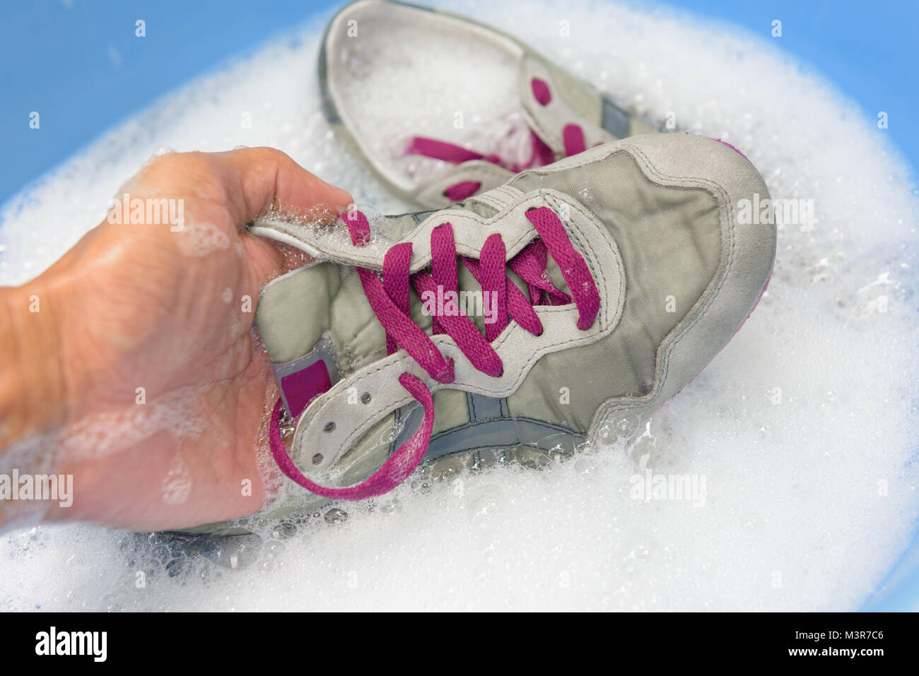 washing the dirty sneakers at home, cleaning the shoes Stock Photo - Alamy