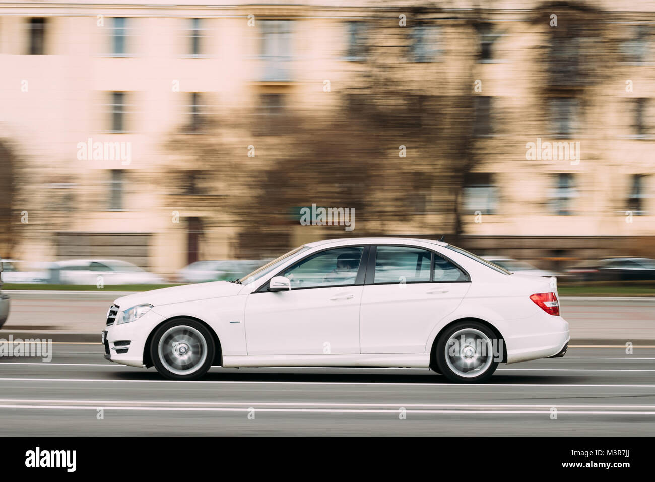 Minsk, Belarus - April 7, 2017: White Color Mercedes-benz C-class In Fast Motion On Street. Stock Photo
