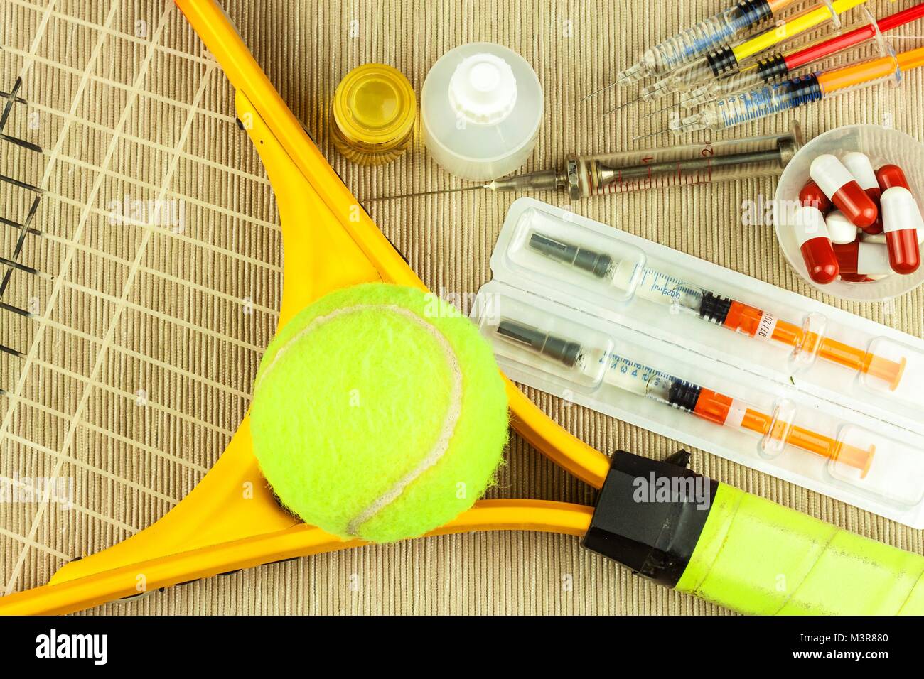 Tennis racket and ball. Anabolic steroids in tennis. Doping in sports Stock  Photo - Alamy