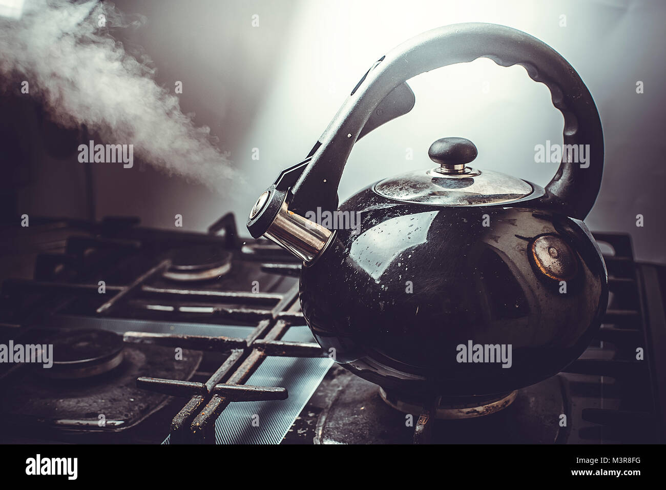 https://c8.alamy.com/comp/M3R8FG/dirty-boiling-kettle-on-the-stove-M3R8FG.jpg