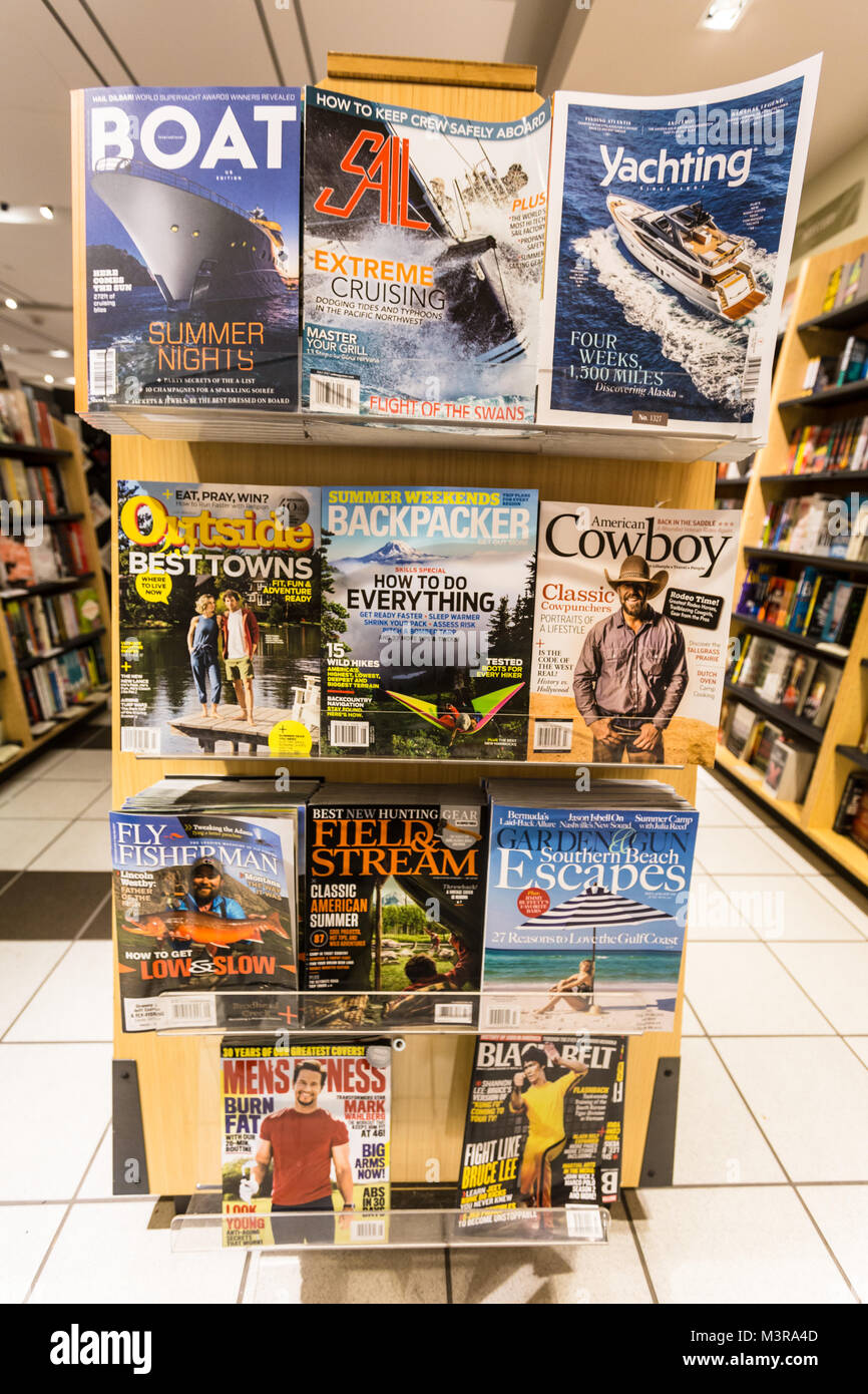 San Francisco, USA - July 2 2017: Magazines of mosty men interest subjects surch as the great outdoors, cowboys or sailing are diplayed in the shelf o Stock Photo