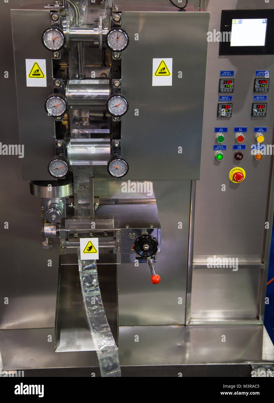 Sauce sachet automatic vertical sealing and packing machine Stock Photo