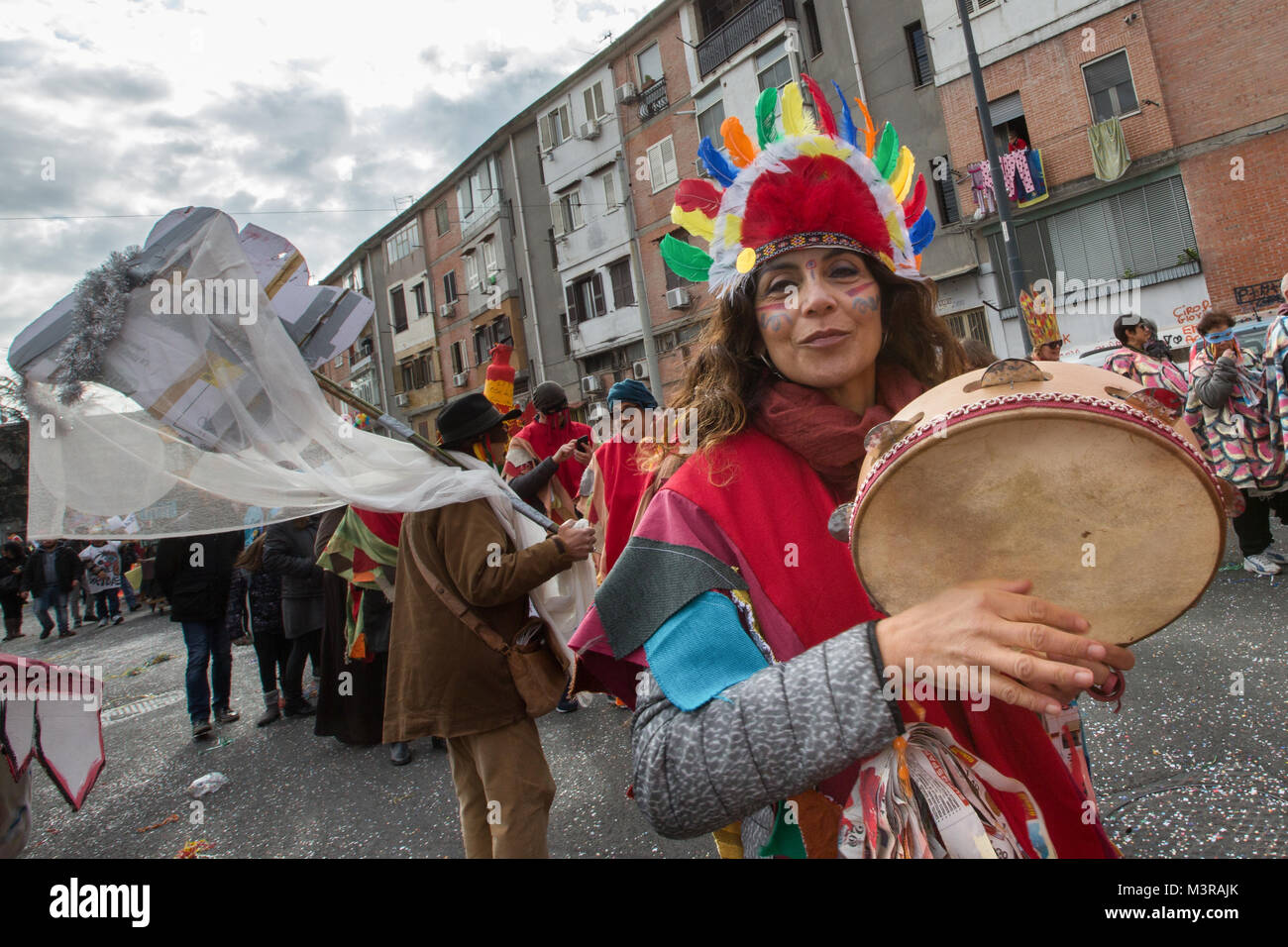 NAPLES, ITALY - FEBRUARY 11, 2018 - Since 1983 in Scampia, district of the north suburbs of Naples, the non-profit cultural association Gridas promotes the Carnival as occasion of social complaint and criticism through the use of masks Stock Photo