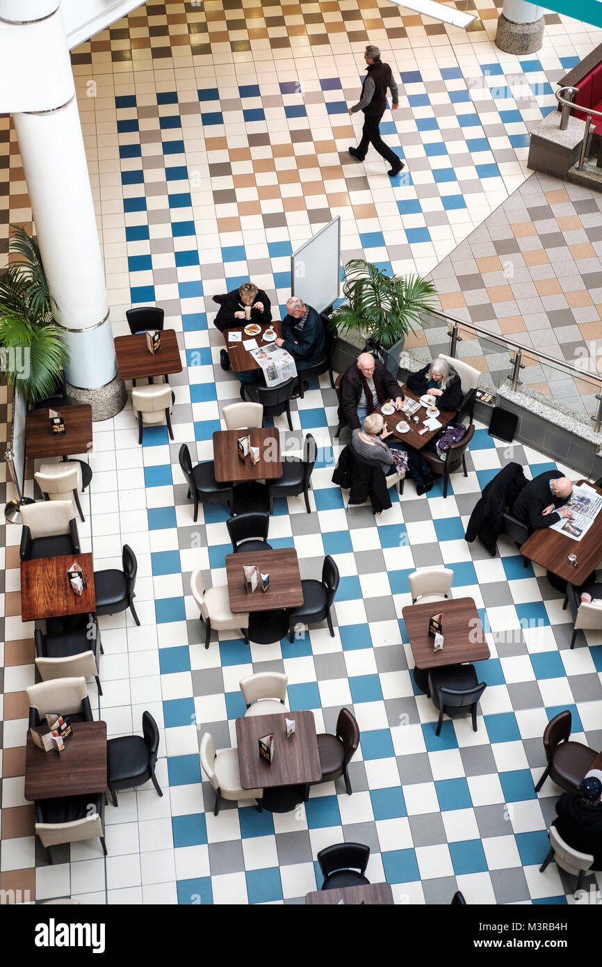 Elevated view-Senior couples in cafe, Saint Nicholas Centre,Sutton,Surrey,UK Stock Photo