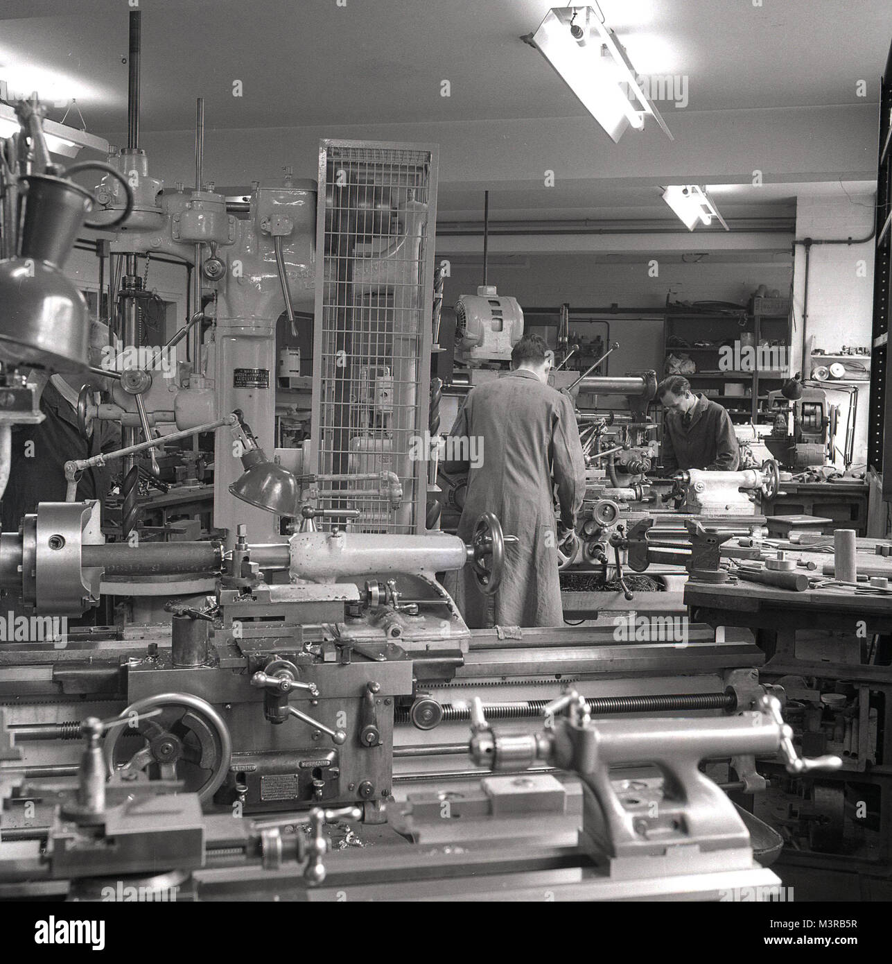 1950s, historical, picture shows various engineering machines including tools and lathes being