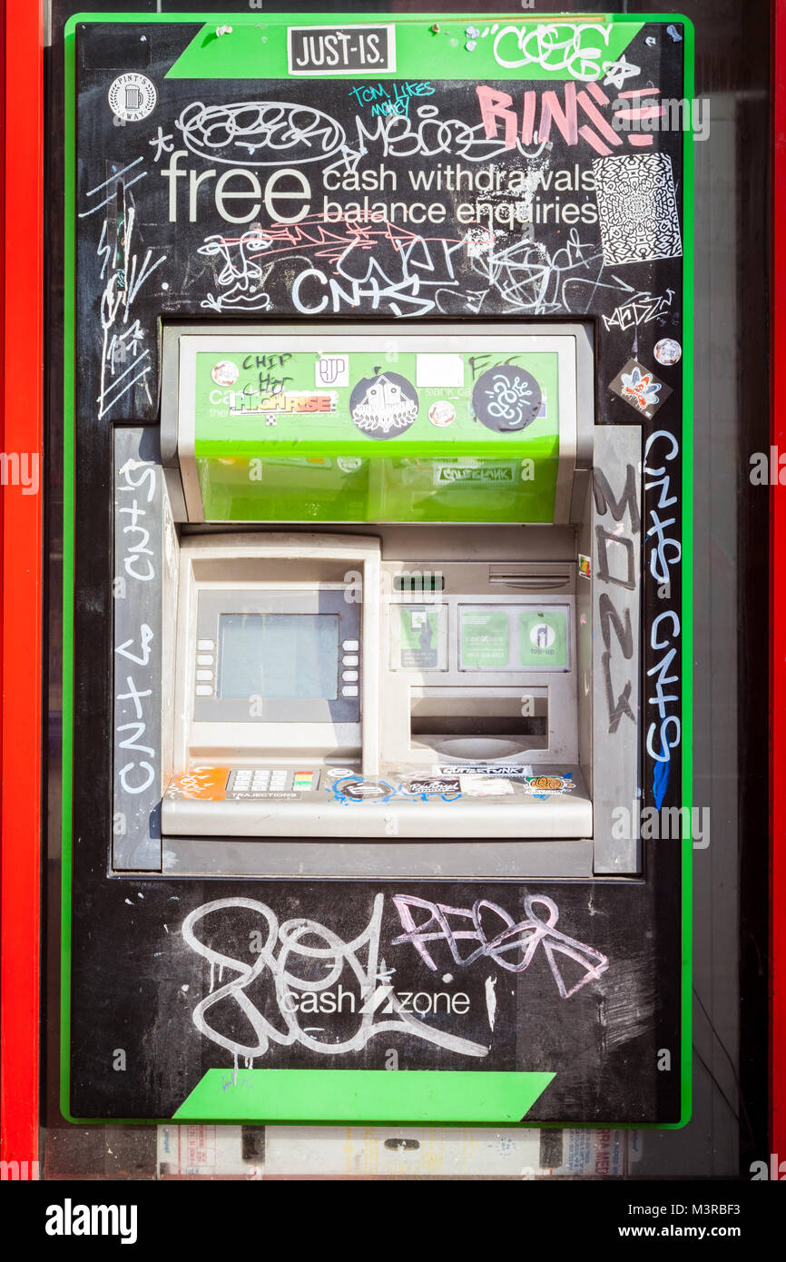 cash machine ATM which has been grafitti uk Stock Photo