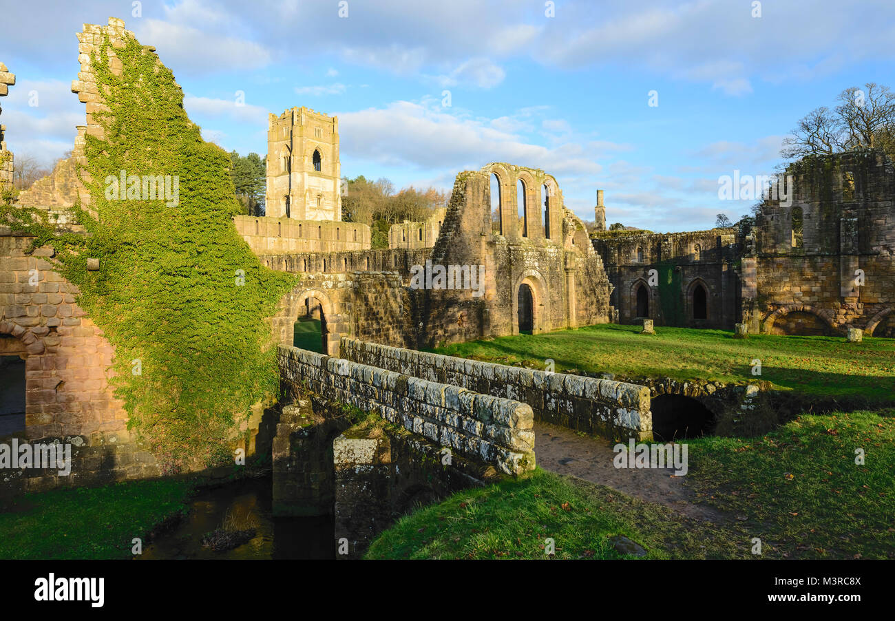 The ruins of Fountains Abbey on a fine autumn morning as viewed from across the river Skell on December 03, 2017 near Stock Photo