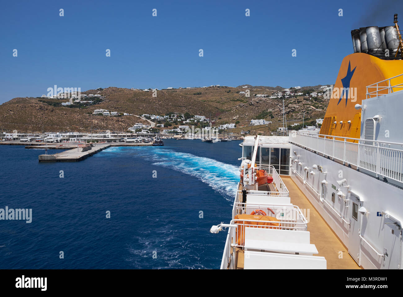 The Blue Star Naxos ferry departing New Port at Mykonos, Cyclades Islands, Aegean Sea, Greece. Stock Photo