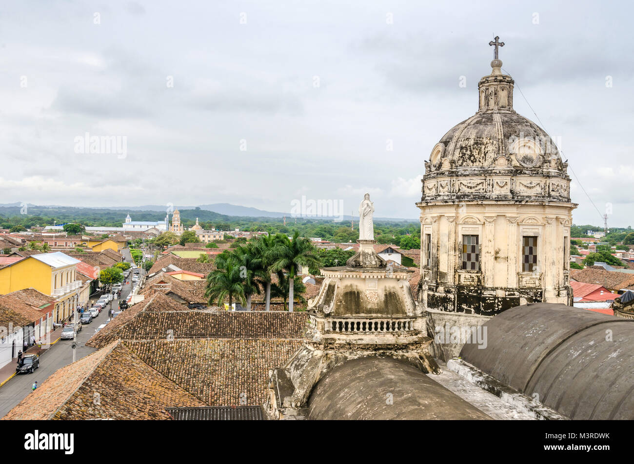 View of Granada city as seen from the bell tower of La Merced Church with the dome to the right, Calle Real Xalteva to the left and Iglesia de Xalteva Stock Photo