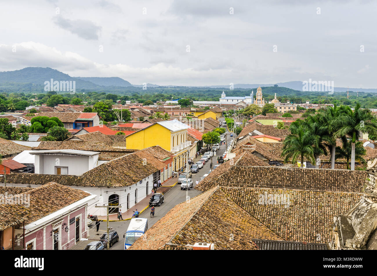 View of Granada city as seen from the bell tower of La Merced Church along the street Calle Real Xalteva with Iglesia de Xalteva catholic church at th Stock Photo