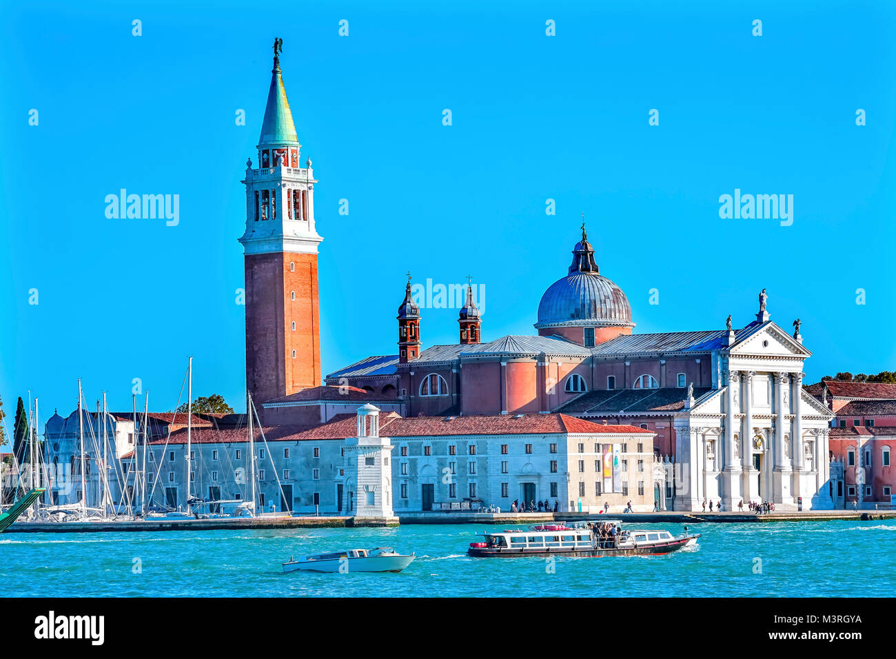 San Giorgio Maggiore Church Grand Canal Boats Venice Italy.  16th Century Benedictine Church on Island Venice Lagoon Stock Photo