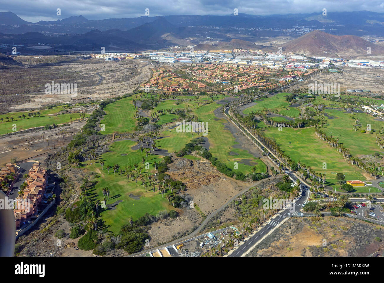 Golf course and urbanisations, seen from aeroplane approaching Tenerife  South airport Stock Photo - Alamy