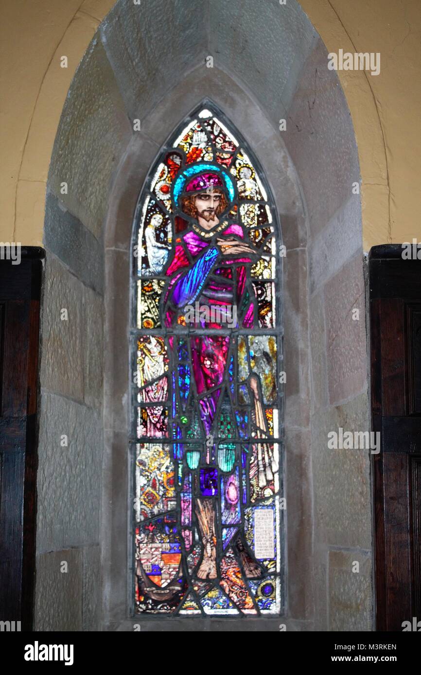 Stained glass figures in a small church by harry clarke in ireland Stock Photo