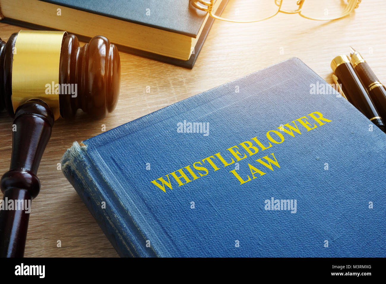 Whistleblower law on a court desk. Stock Photo