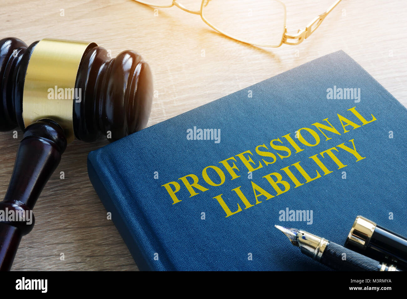 Professional liability on a court table. Stock Photo