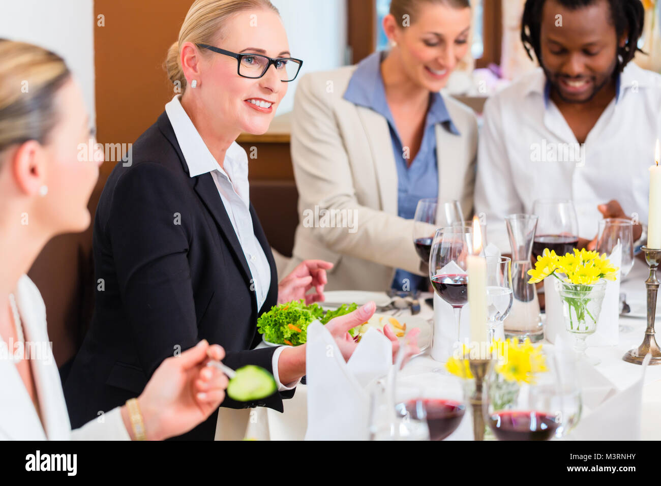 Business lunch in restaurant with food and wine Stock Photo
