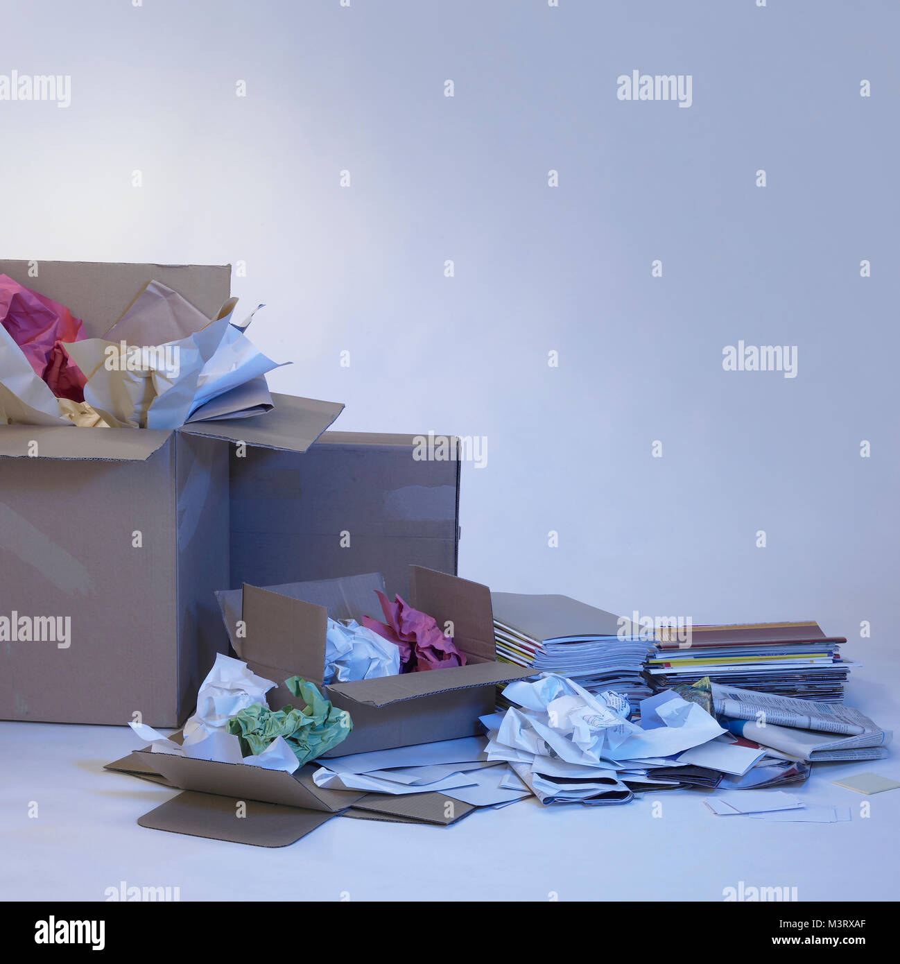 wastepaper and paper boxes in blue ambiance Stock Photo