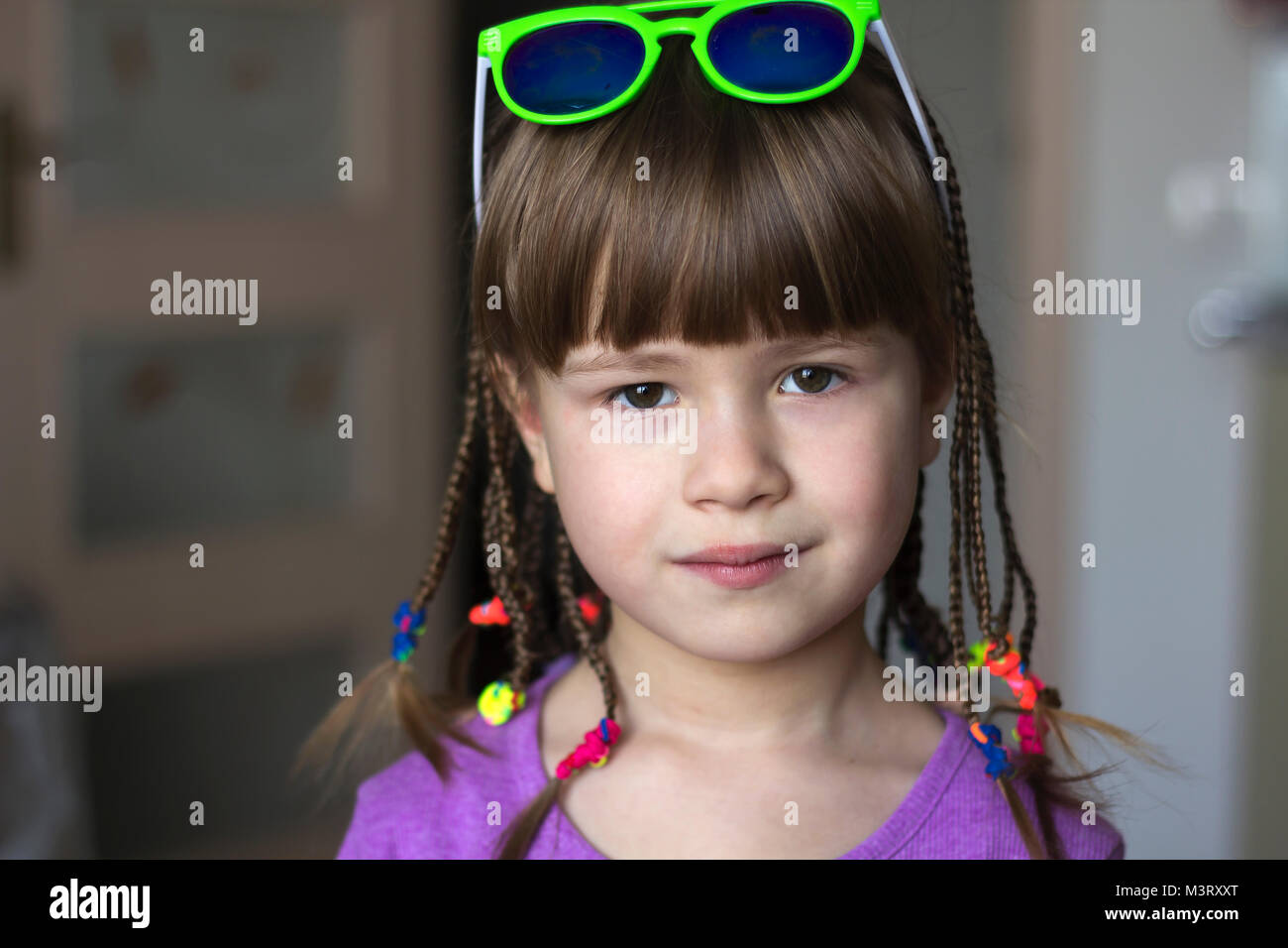 Portrait of pretty little girl with small braids Stock Photo - Alamy