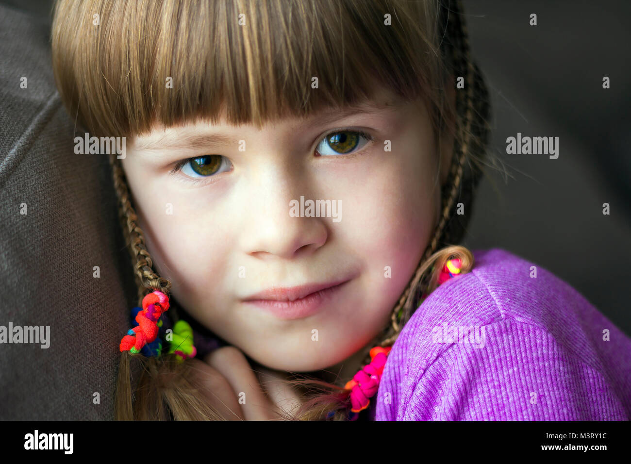 Portrait of pretty little girl with small braids Stock Photo - Alamy