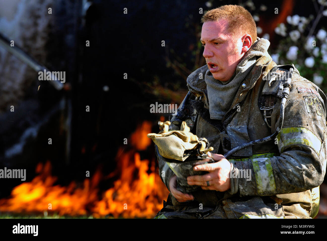 A Prince George's County firefighter takes off his self-contained ...
