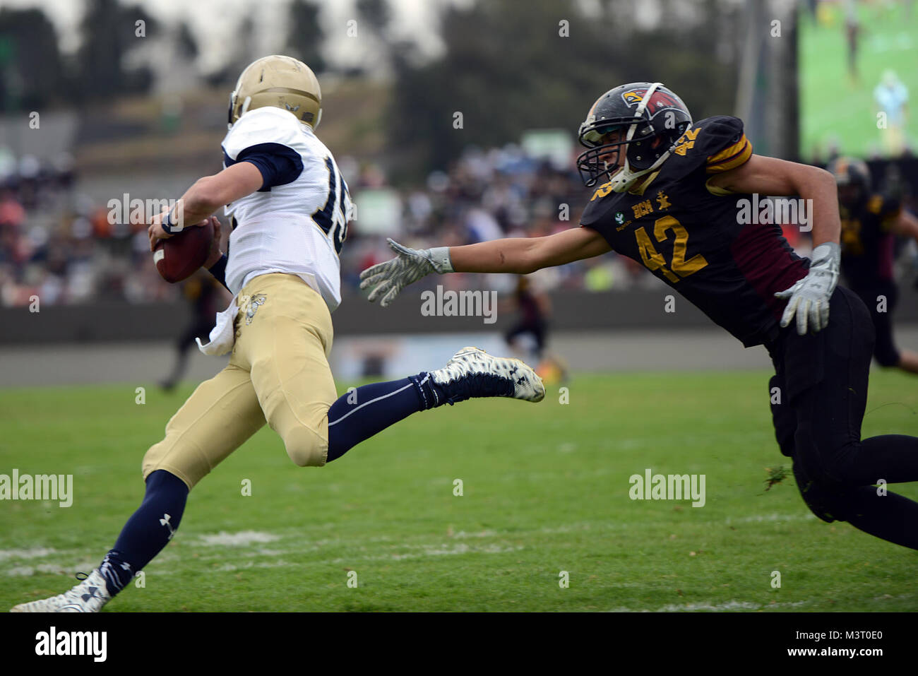 united-states-naval-academy-midshipman-nick-deterding-dashes-through-the-playing-field-during