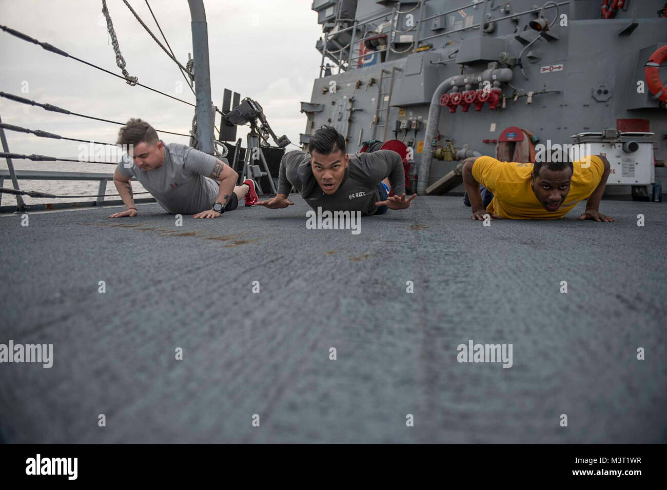 160217-N-MD297-064 PACIFIC OCEAN (Feb. 17, 2016) - Sailors aboard the Arleigh Burke-class guided-missile destroyer USS Lassen (DDG 82) perform quick-release push-ups during a Squid Fit class. Lassen is currently underway in support of Operation Martillo, a joint operation with the U.S. Coast Guard and partner nations within the 4th Fleet area of responsibility. Operation Martillo is being led by Joint Interagency Task Force South, in support of U.S. Southern Command. (U.S. Navy photo by Mass Communication Specialist 2nd Class Huey D. Younger Jr./Released) 160217-N-MD297-064 by U.S. Naval Force Stock Photo