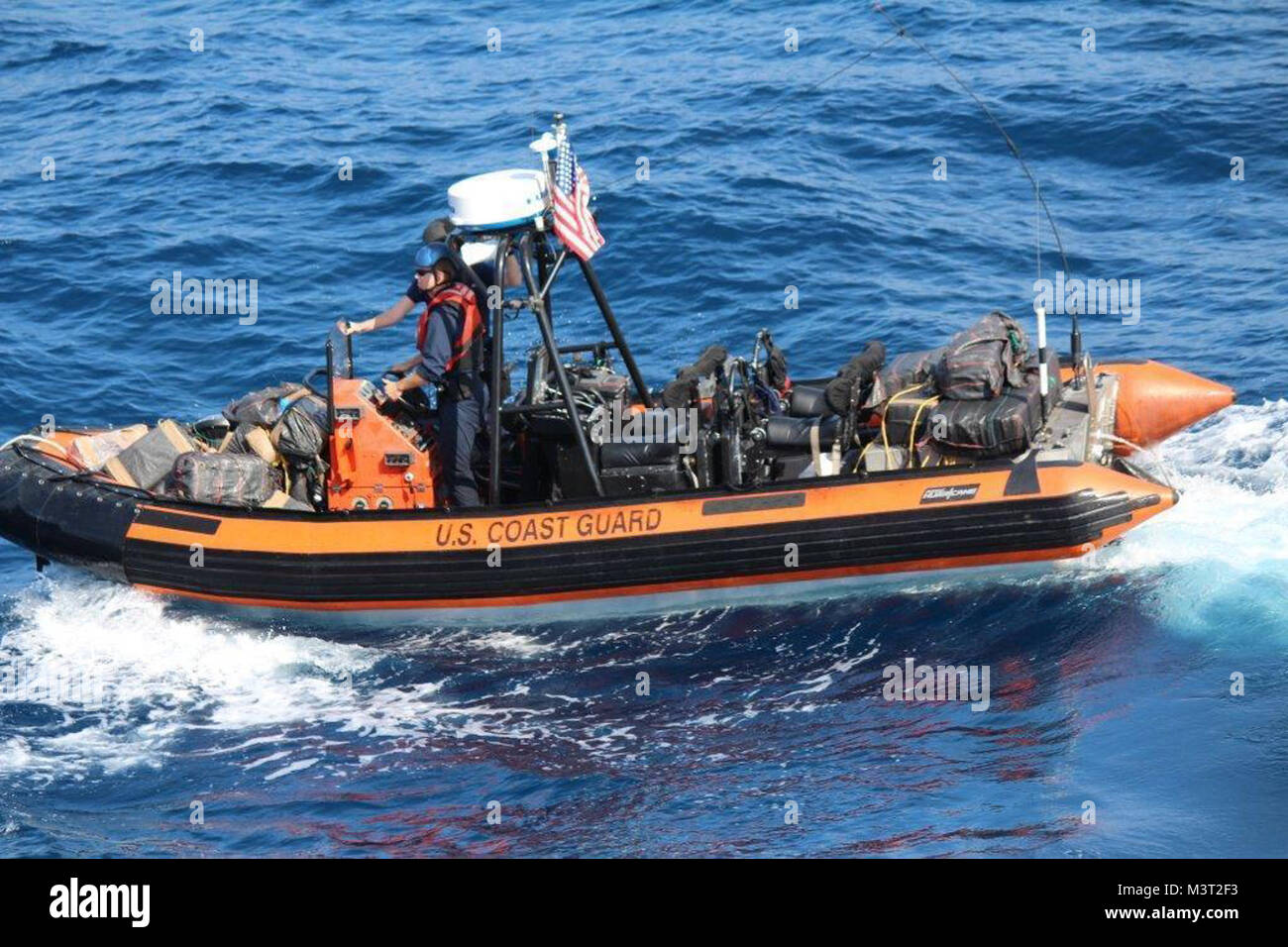 Coast Guard Cutter Valiant crew transports seized contraband from one of the eight vessels interdicted during their eight-week patrol in the Eastern Pacific. Before returning home to Naval Station Mayport, Florida March 9, 2016, the cutter seized approximately $141 million worth of contraband. These counter-drug interdictions were carried out as part of Operation Martillo, an international operation focused on sharing information and bringing together air, land, and maritime assets from the U.S. Department of Defense, the Department of Homeland Security, and Western Hemisphere and European par Stock Photo