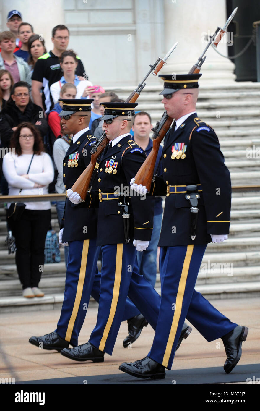 With full Ceremonial Honors presented, members of the U.S. Army Honor Guard march into place at the Tomb of the Unknowns prior to the arrival of The Right Honorable Justin Trudeau, Prime Minister of Canada. The Prime Minister was at Arlington National Cemetery to lay a wreath at the Tomb of the Unknowns in honor of the Prime Minister’s official visit to the United States. (Department of Defense photo by Marvin Lynchard) 160311-D-FW736-022 by DoD News Photos Stock Photo