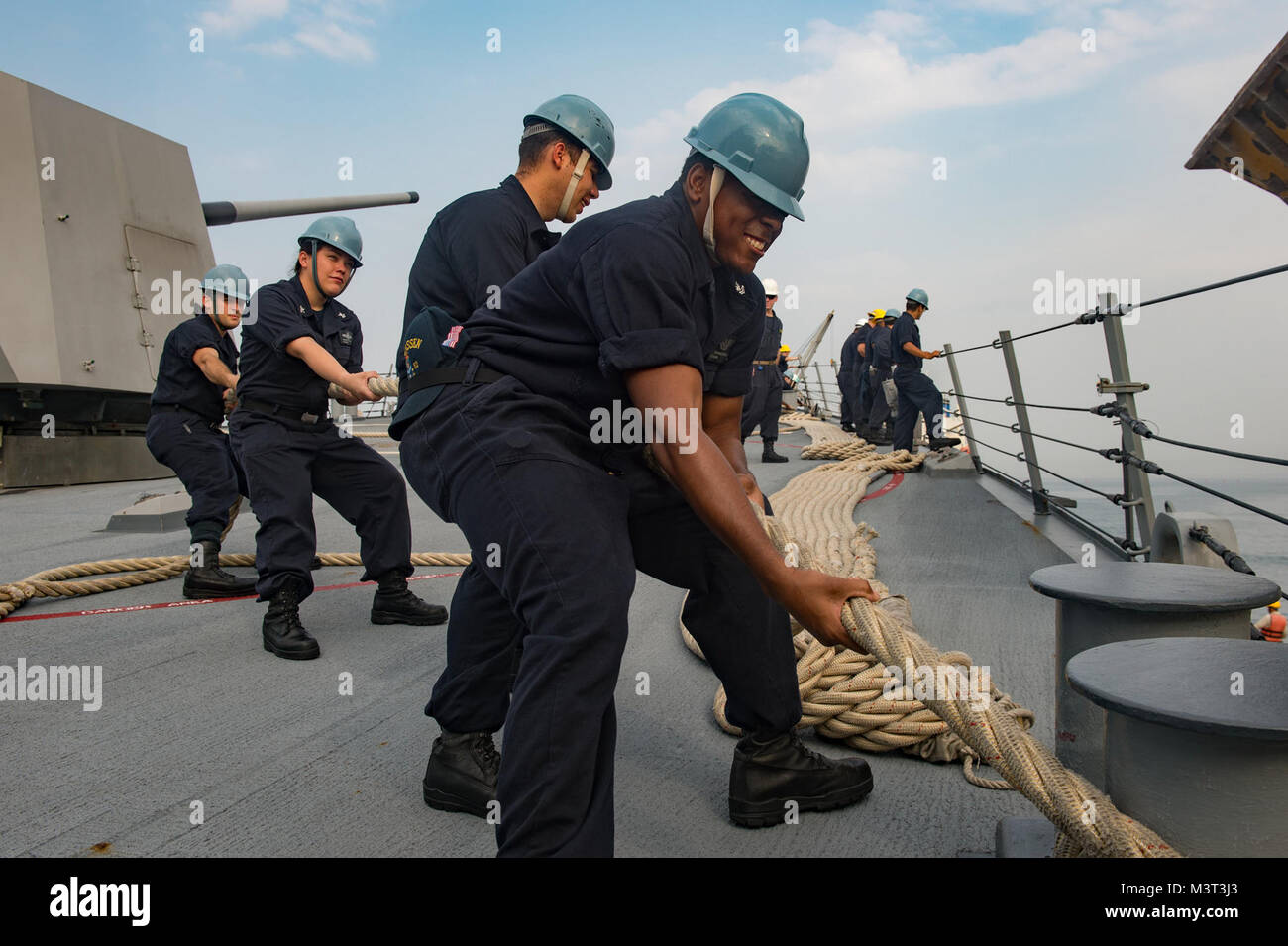 160413-N-MD297-014 ACAJUTLA, El Salvador (April 13, 2016) Sailors aboard the Arleigh Burke-class guided-missile destroyer USS Lassen (DDG 82) heave a mooring line as the ship moors in Acajutla, El Salvador for a brief stop for fuel (BSF). Lassen is currently underway in support of Operation Martillo, a joint operation with the U.S. Coast Guard and partner nations within the 4th Fleet area of responsibility. Operation Martillo is being led by Joint Interagency Task Force South, in support of U.S. Southern Command. (U.S. Navy photo by Mass Communication Specialist 2nd Class Huey D. Younger Jr./R Stock Photo