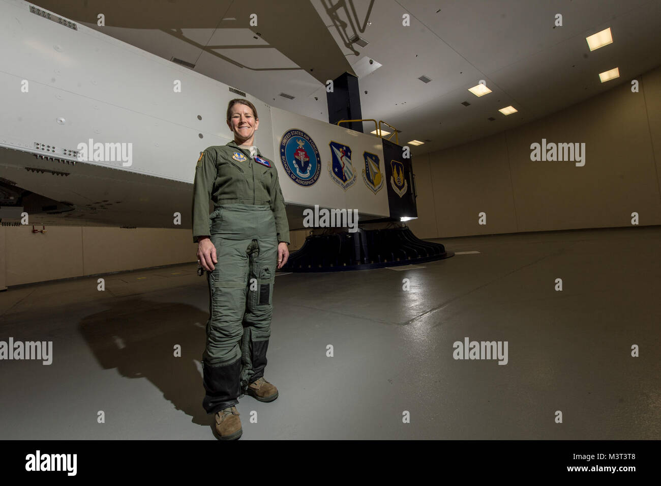 Col. Kathryn Hughes, a pilot-physician and director, Human Systems Integration, 711th Human Performance Wing, stands in front of a centrifuge at Wright-Patterson Air Force Base, Ohio, April 22, 2016. Hughes, an A-10 Thunderbolt II pilot, was instrumental in integrating the full-coverage G-suit into the Air Force inventory. (U.S. Air Force photo/Master Sgt. Brian Ferguson) 160422-F-BP133-055.jpg Stock Photo