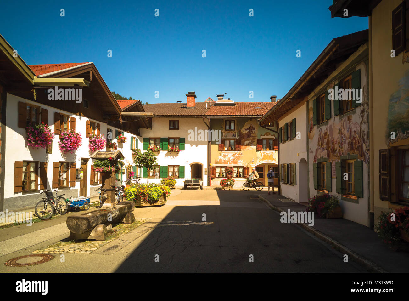 Traditional lowrise residential houses decorated with murals and plants in Mittenwald, Germany