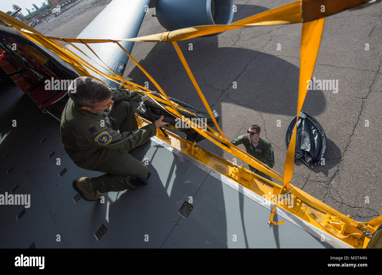 U.S. Air Force Captain Remington Barnes (left), a pilot with the 351st