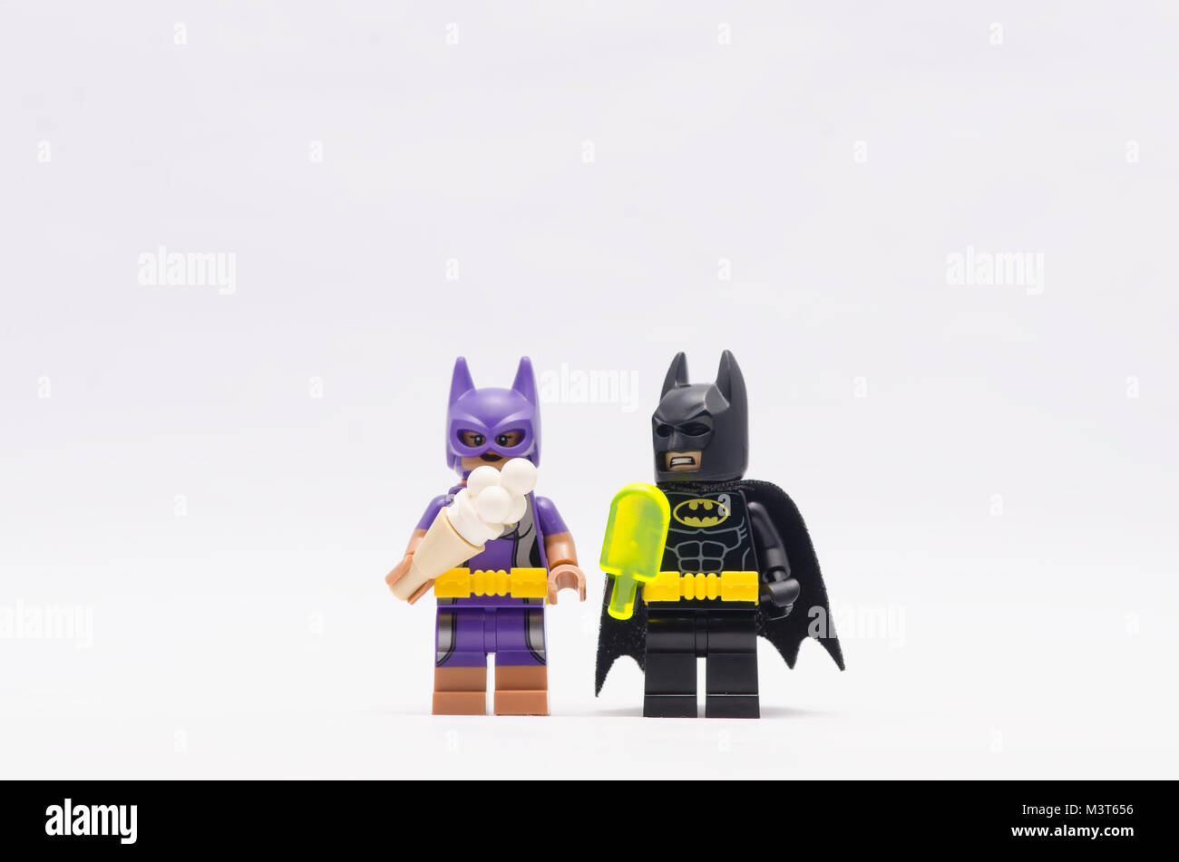 lego batman and batgirl holding ice cream. isolated on white background  Stock Photo - Alamy