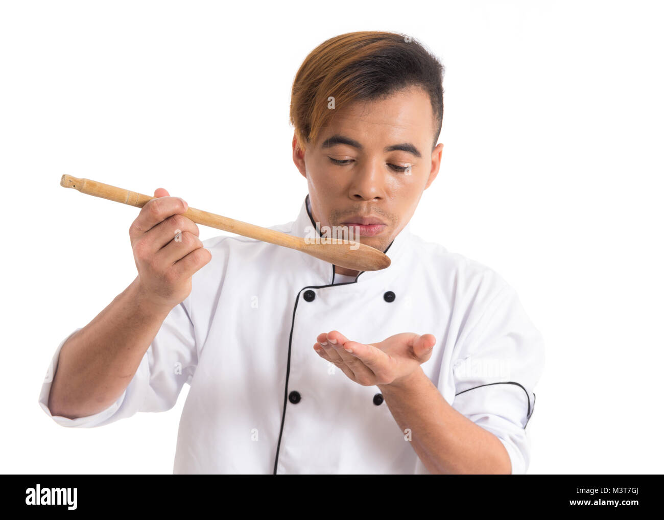 Premium Photo  Chef cook tasting food with wooden spoon at the restaurant  kitchen