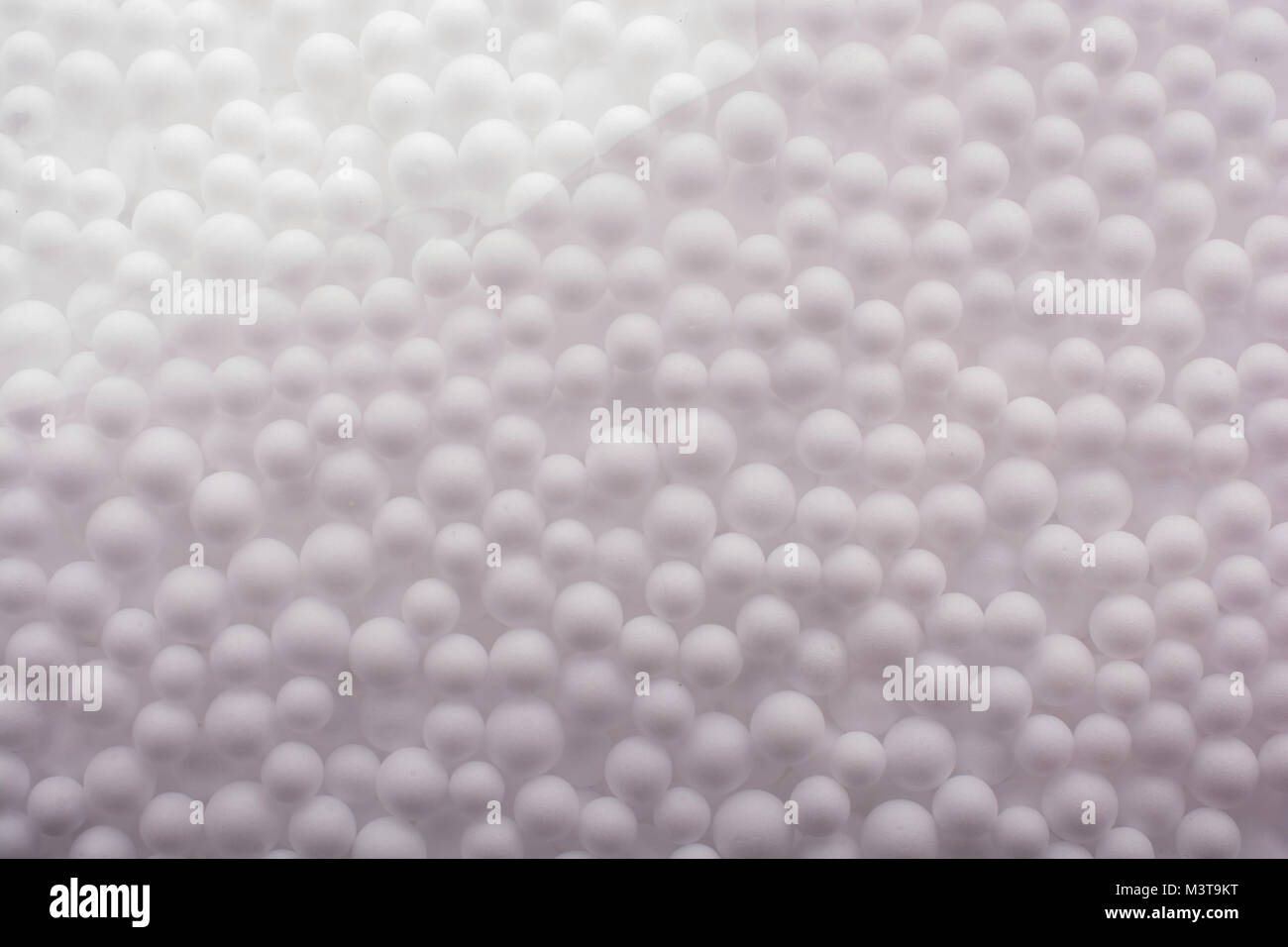 White little polystyrene foam balls as background Stock Photo - Alamy