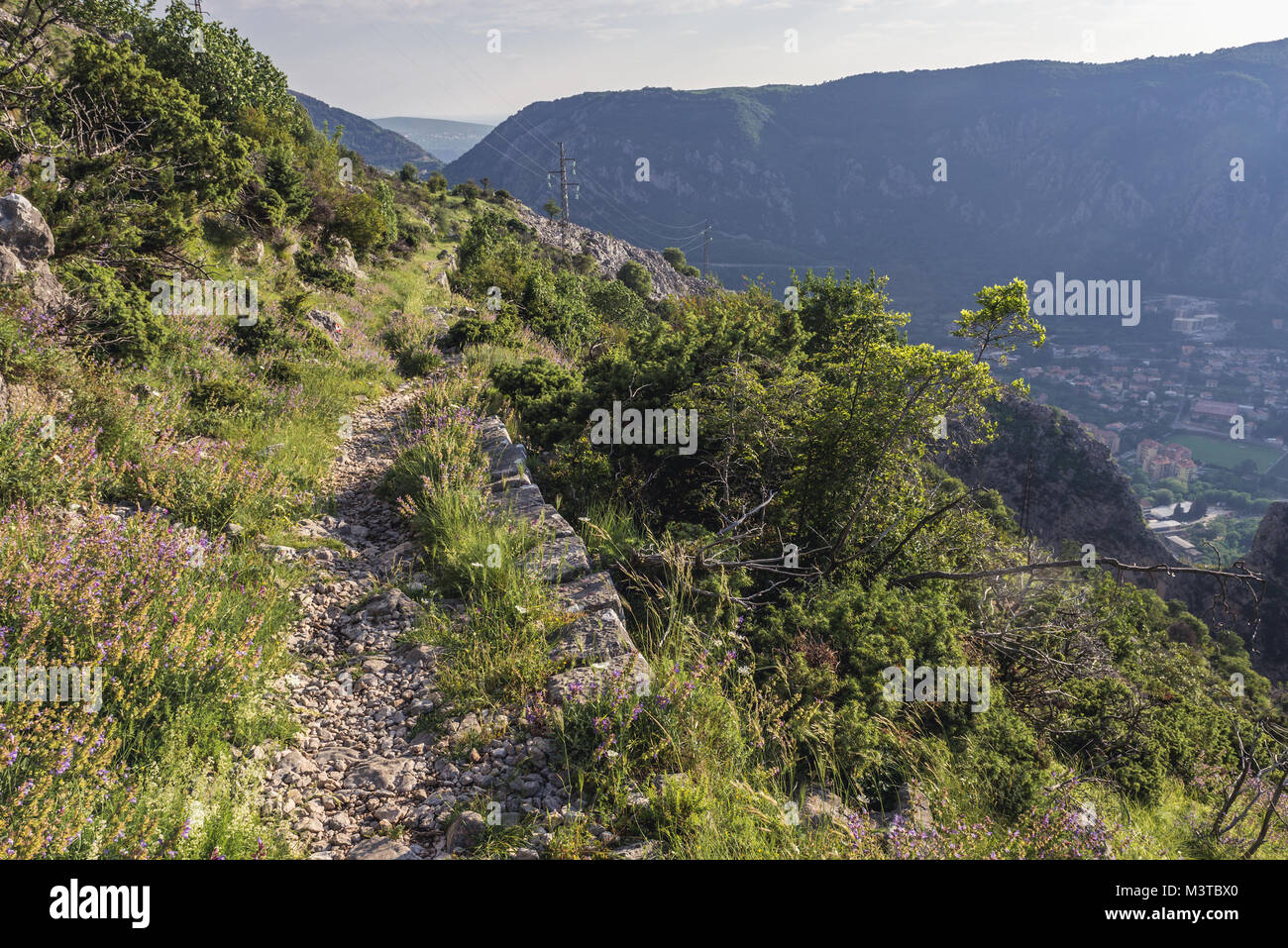 Tourist path on the mountain above Kotor coastal city, located in Bay of Kotor of Adriatic Sea, Montenegro Stock Photo