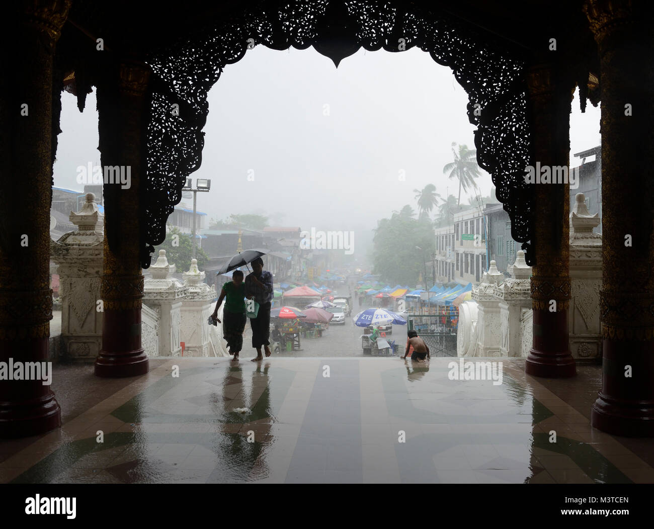Entrance to Shwedagon Pagoda on a rainy day, Yangon, Myanmar Stock Photo