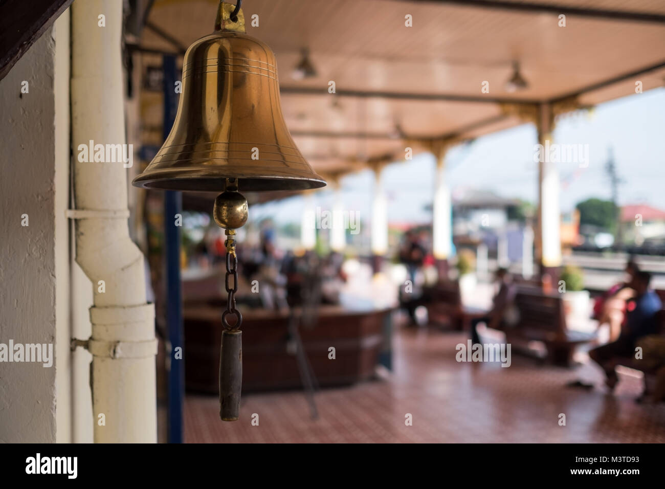 The old bell rings in train station in Thailand Stock Photo