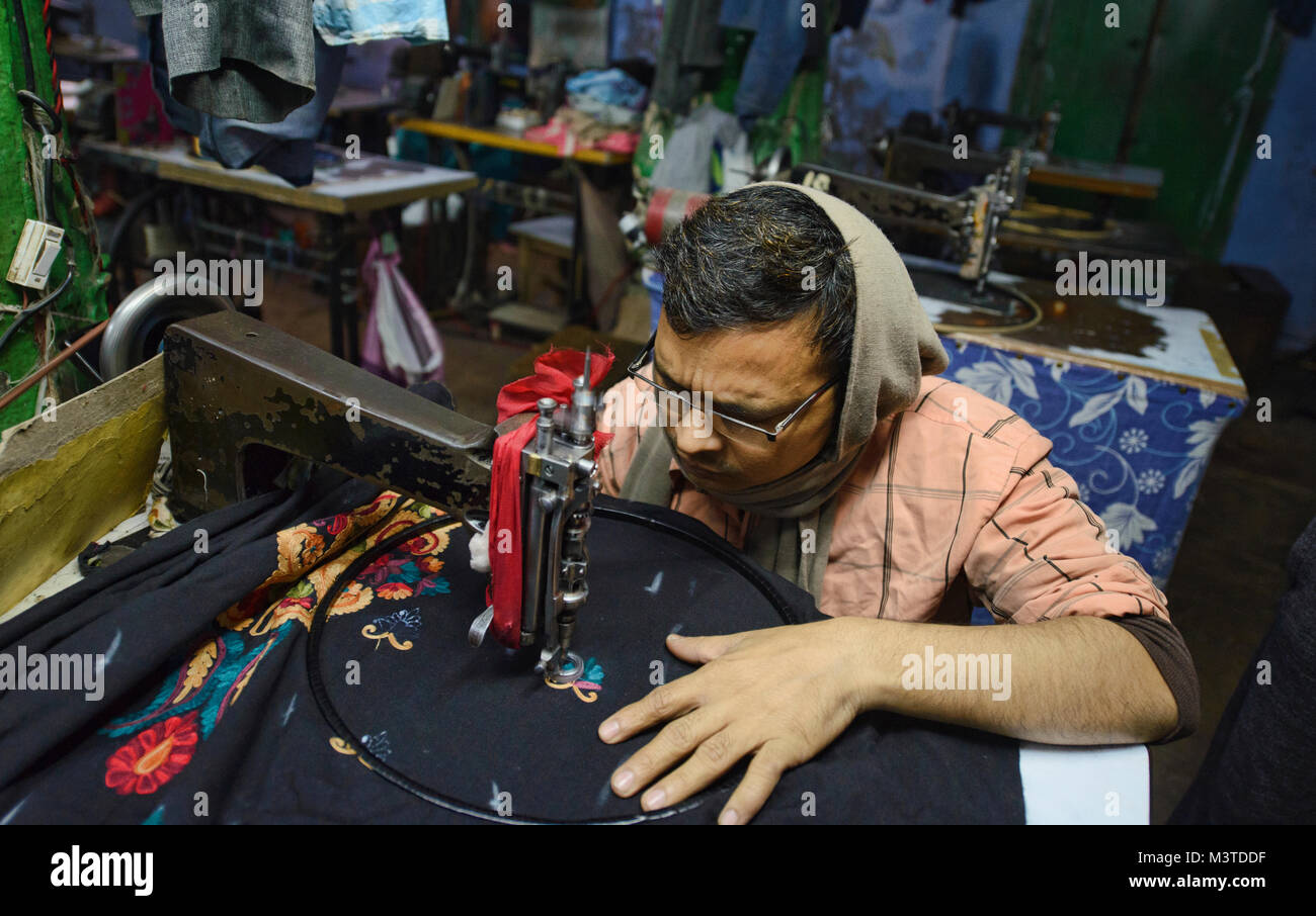 Expert stitcher at work in a garment factory in Old Delhi, India Stock Photo