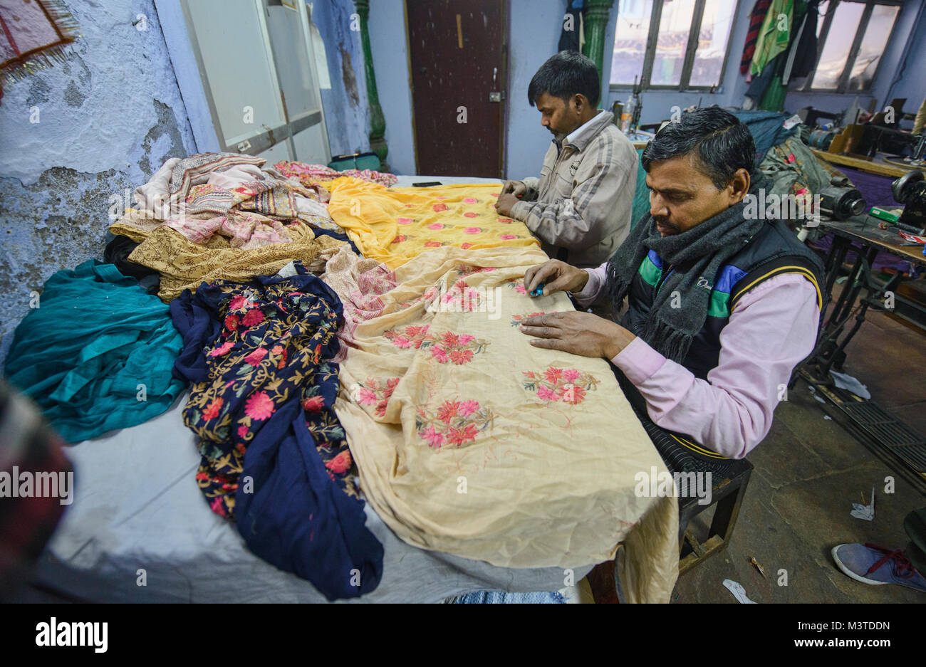Expert stitcher at work in a garment factory in Old Delhi, India Stock Photo