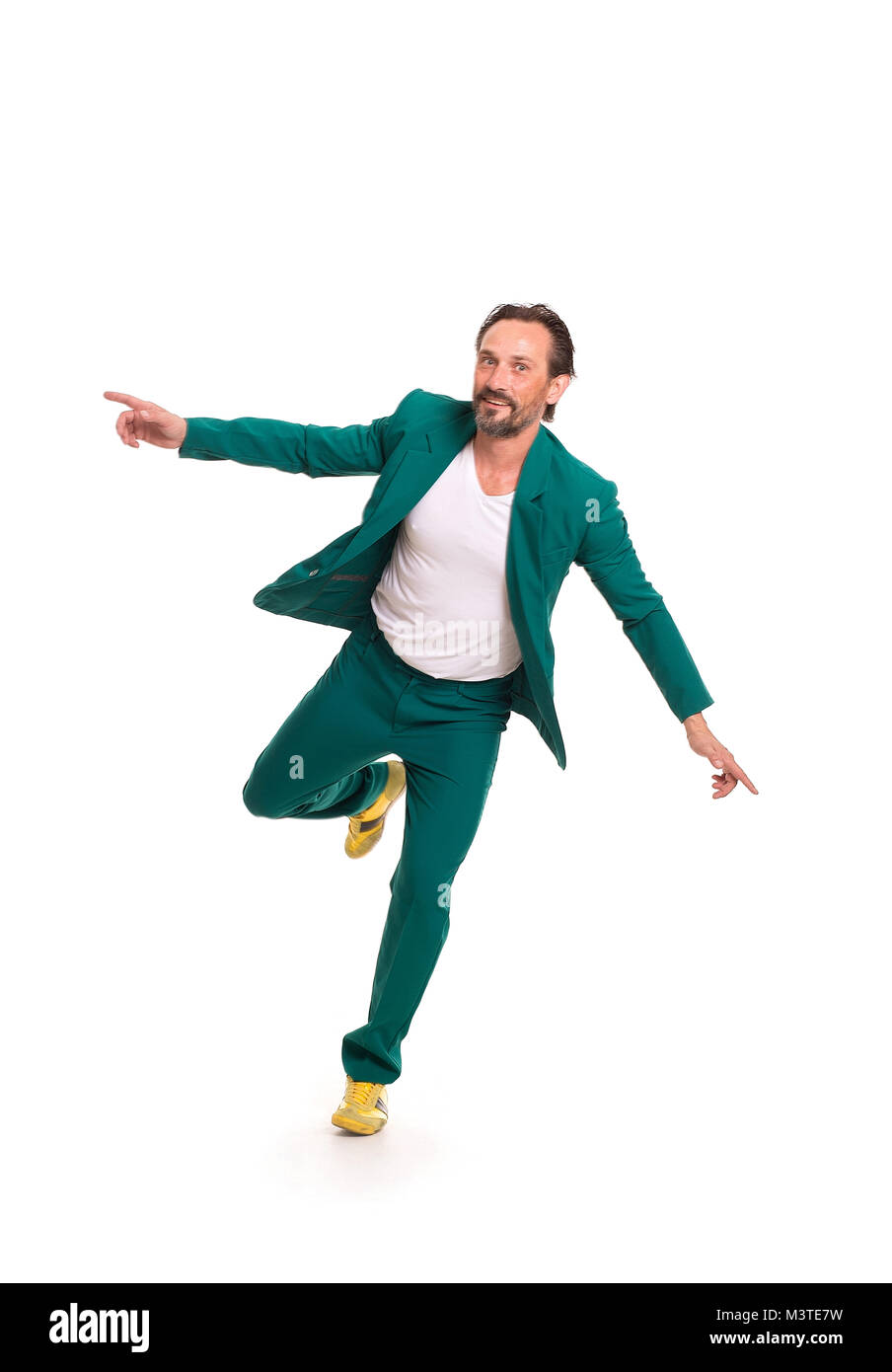 Handsome man in green suit Stock Photo