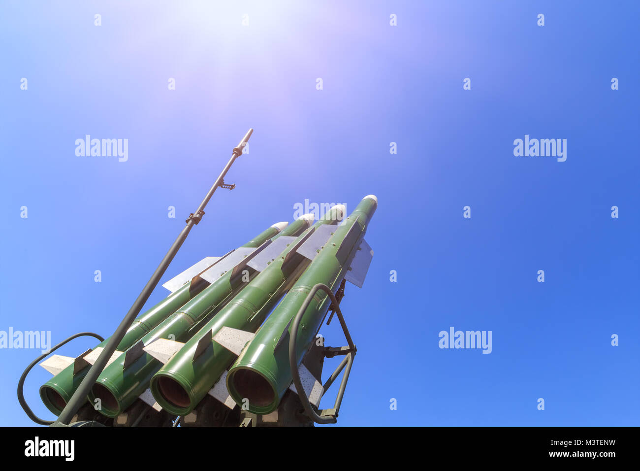 Launcher of the self-propelled system Buk M2 with four missiles on the blue sky background Stock Photo