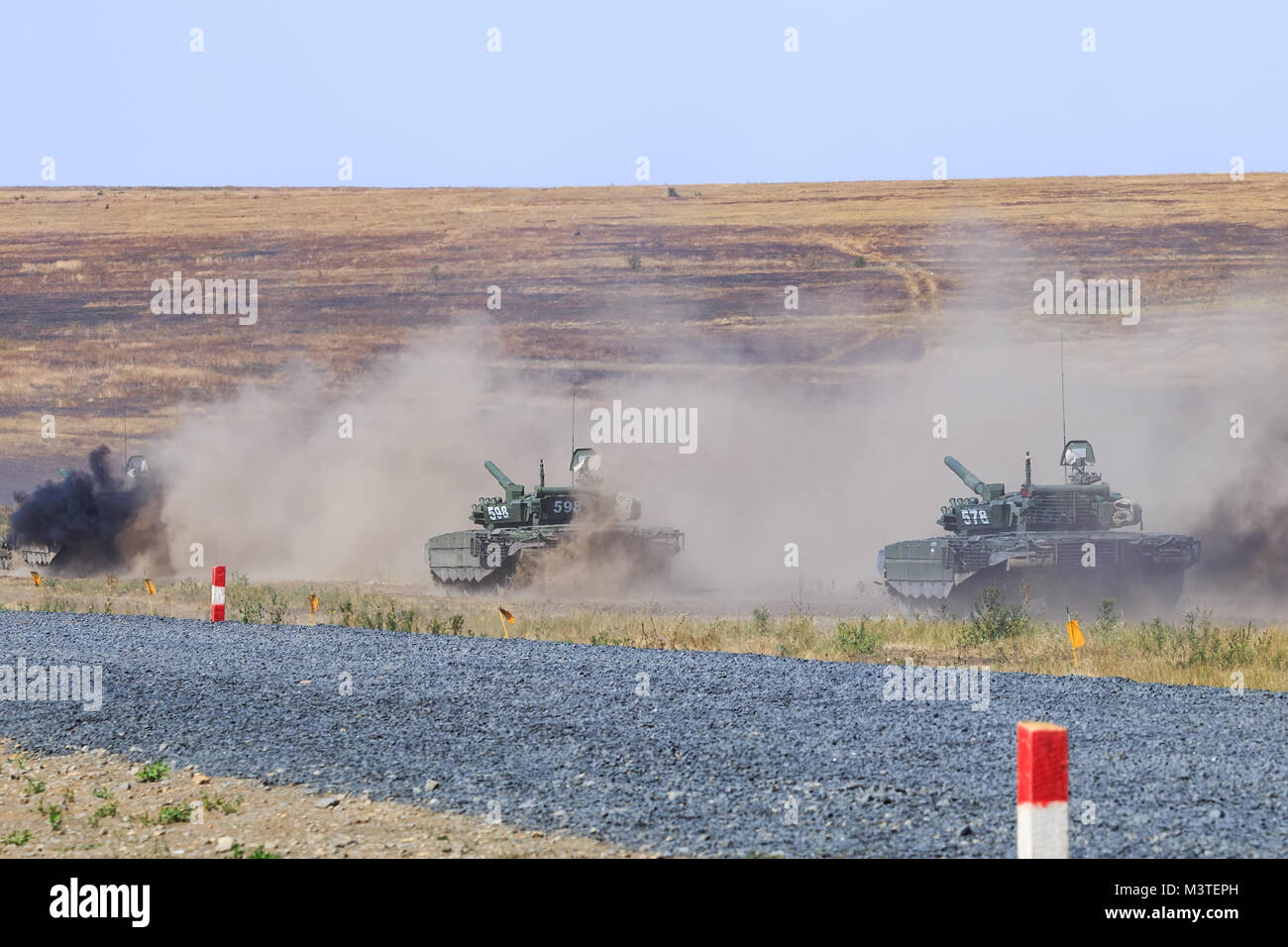 NOVOCHERKASSK, RUSSIA, 26 AUGUST 2017: A few modern T-90 tanks are moving at the military training ground Stock Photo